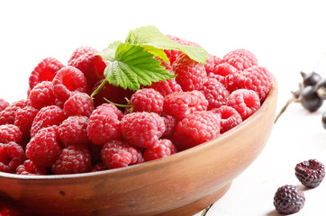 Ceramic bowl with organic raspberries