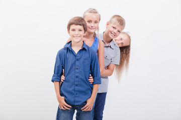 Fototapeta premium The smiling teenagers on white 