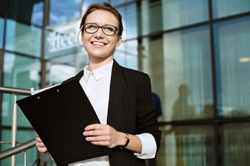 Fototapeta premium Happy Business woman, successful business lady portrait, manager holding documents.