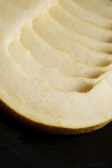Ripe melon on a dark background, selective focus