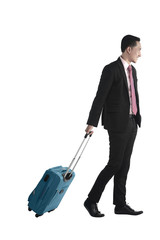 Business man walking with suitcase