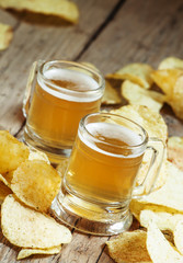 Pair of light beer and chips, unhealthy eating concept, selectiv