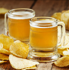 Pair of light beer and chips, unhealthy eating concept, selectiv
