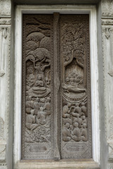 Fototapeta na wymiar Buddha Sculpture doors on Thai temple in Thailand. 