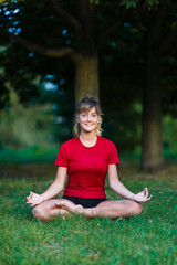 Cute young girl doing yoga exercises