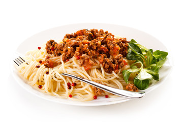 Pasta with meat, tomato sauce and vegetables on white background