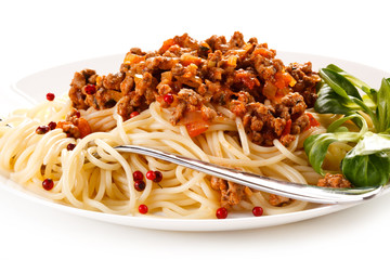 Pasta with meat, tomato sauce and vegetables on white background