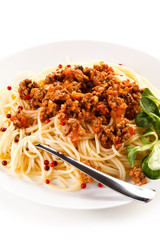 Pasta with meat, tomato sauce and vegetables on white background