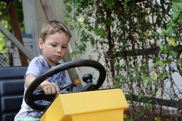 Kid driving a tractor