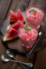Watermelon granitas and fresh watermelon slices, studio shot