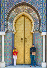 Two asian tourist stand in front of Bab Dar Lmakhzen or the Roya