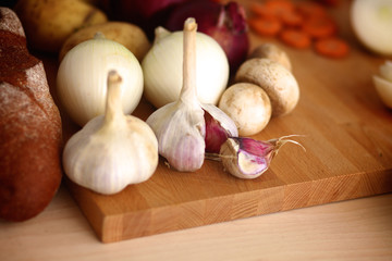 Young woman cutting vegetables in the kitchen