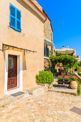 Houses on street in typical Corsican mountain village of Sant Antonino, Corsica island, France