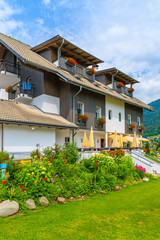 Fototapeta na wymiar Traditional alpine house in a village on shore of Weissensee lake in summer time, Austria