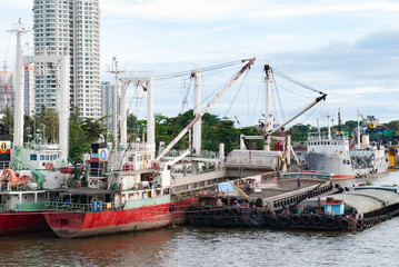 Cargo Ship docked in Chao Phraya River, Bangkok, Thailand