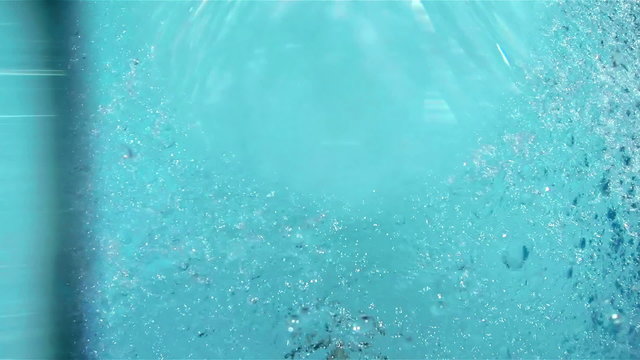 Jets of water spray falling into the pool