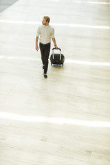 Fototapeta premium Young man with suitcase