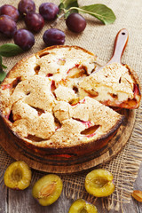 Pie with plums on the table