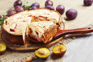 Pie with plums on the table