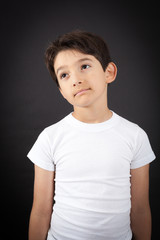 Handsome boy doing different expressions in different sets of clothes: thinking