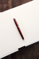 Pen on open notebook