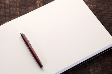 Pen on open notebook