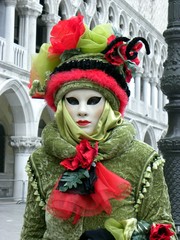 Fototapeta na wymiar Pink, red and green traditional costume in Venice