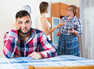 Home conflict at young family with mother