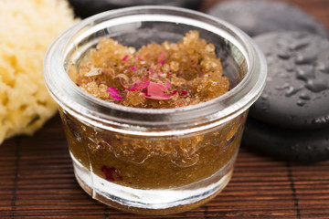 Homemade body peeling with sugar, olive oil and rose petal