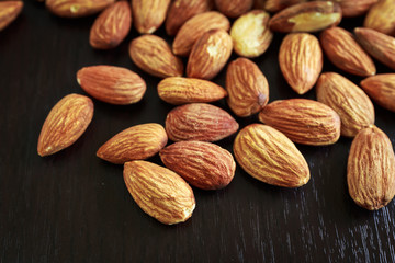 Pile of almonds place on the table, selective focus point