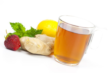 Cup of black tea with ginger, lemon and mint