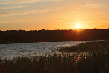Sunrising over a peaceful lake in Oklahoma