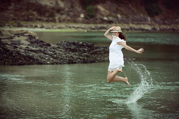 beautiful young woman jumping