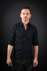 Obraz premium handsome man doing different expressions in different sets of clothes: posing