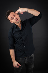 Naklejka premium handsome man doing different expressions in different sets of clothes: suicide