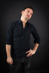 Naklejka premium handsome man doing different expressions in different sets of clothes: tired