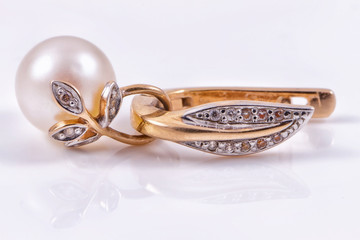 Beautiful gold earring with pearl