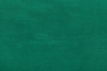 background from dark green batiste fabric