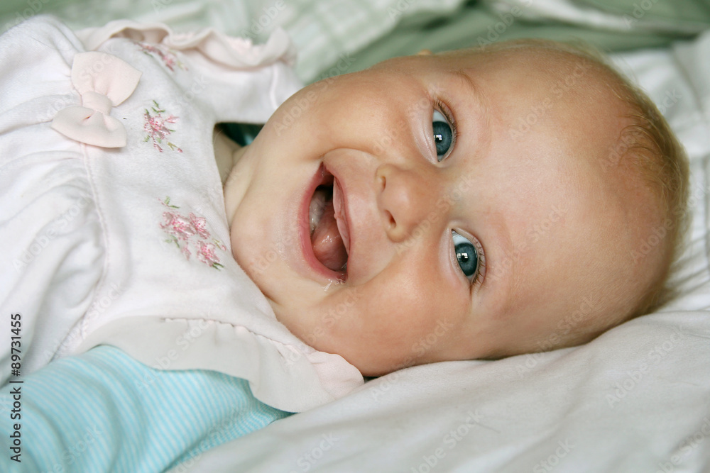 Wall mural Super Happy 4 Month Old Baby Girl Smiling