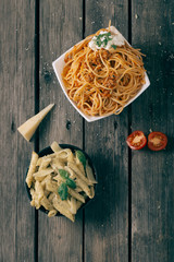 Italian pasta on the wooden table,