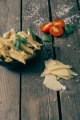 Italian pasta on the wooden table,