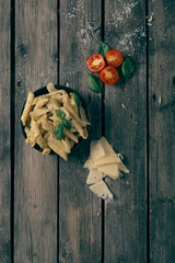 Italian pasta on the wooden table,