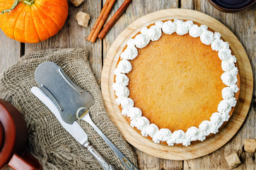 pumpkin cheesecake decorated with whipped cream