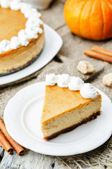 pumpkin cheesecake decorated with whipped cream