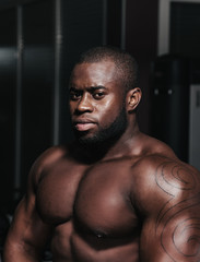 Fototapeta na wymiar Weight training African bodybuilder portrait