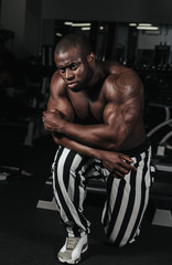 Obraz na płótnie Canvas Weight training African doing bodybuilding