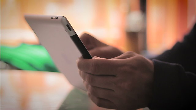 Man hand using tablet