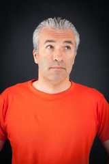 Handsome man doing different expressions in different sets of clothes: thinking