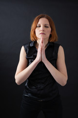 Beautiful woman doing different expressions in different sets of clothes: prayer