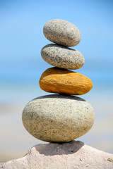 Fototapeta na wymiar Rocks balanced in a stack at the beach.